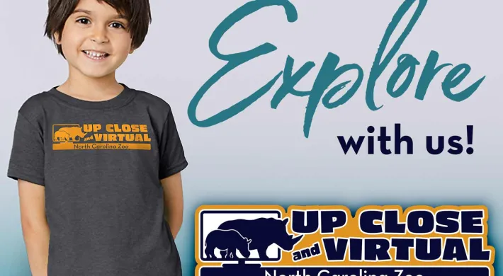 A graphic featuring a smiling young boy in a dark t-shirt with a logo on it, next to the cursive text "Explore with us!" At the bottom right is an overlay graphic for "UP CLOSE VIRTUAL."