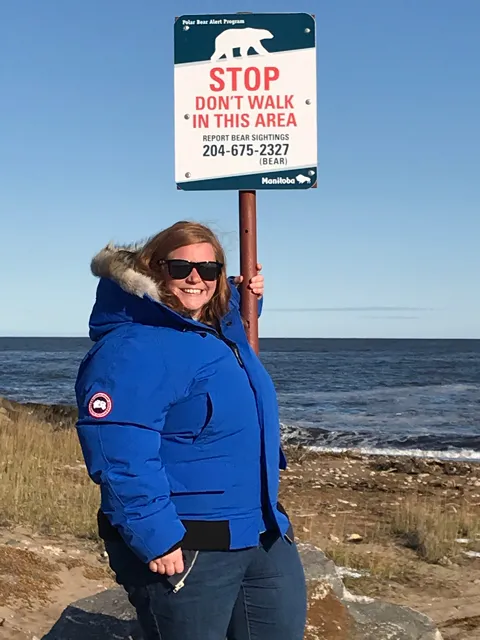 Leslie Wilhoit and Polar Bear alert sign