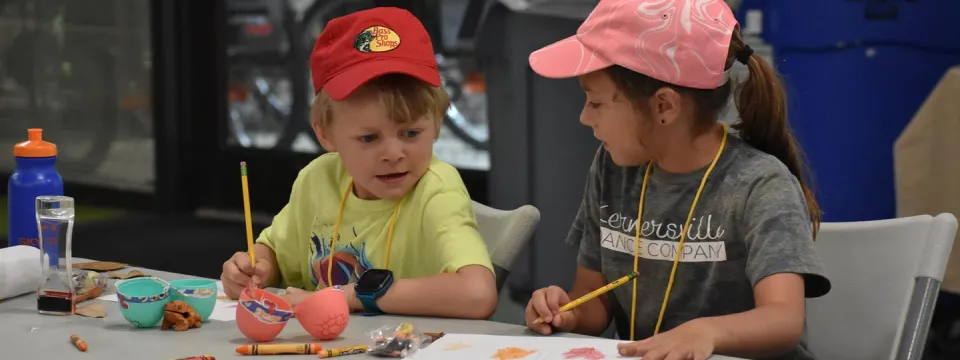 campers doing an arts and craft activity 
