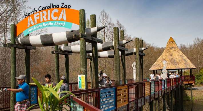 Guests at the Africa Bridge Entrance of the North Carolina Zoo.