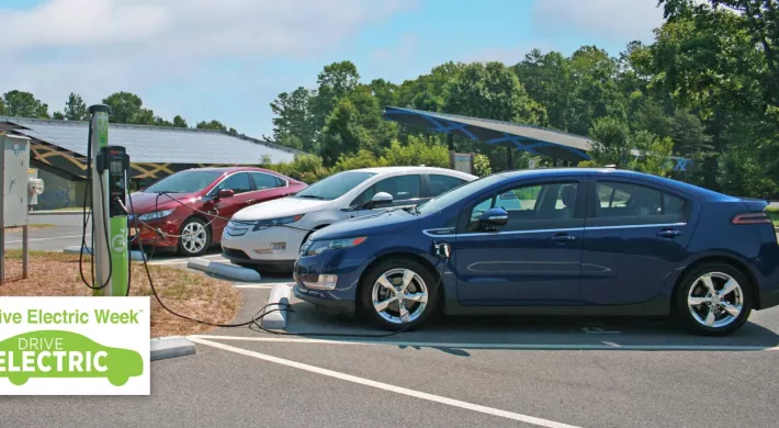 Drive electric event promo with electric vehicle charging station