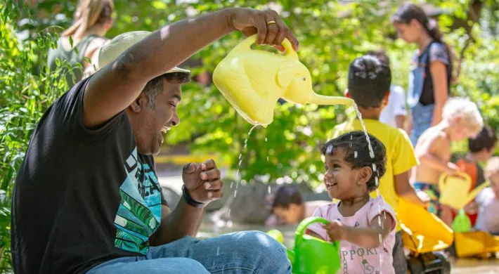 A father plays with his young daughter in the Kidzone Play Stream.