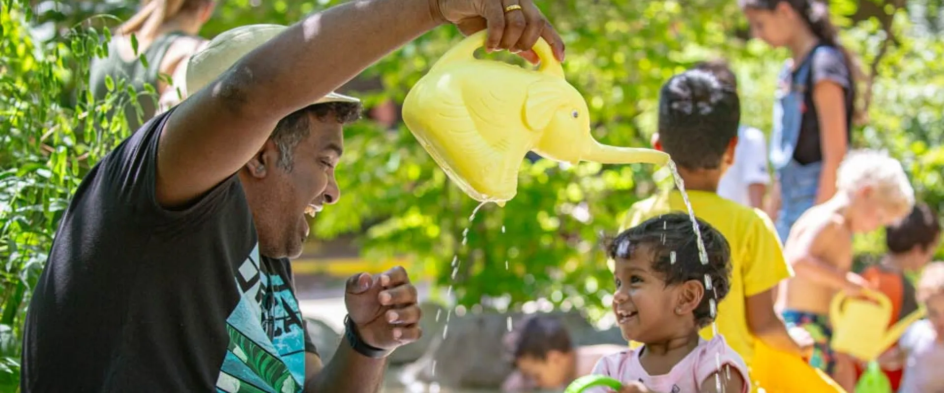 A father plays with his young daughter in the Kidzone Play Stream.