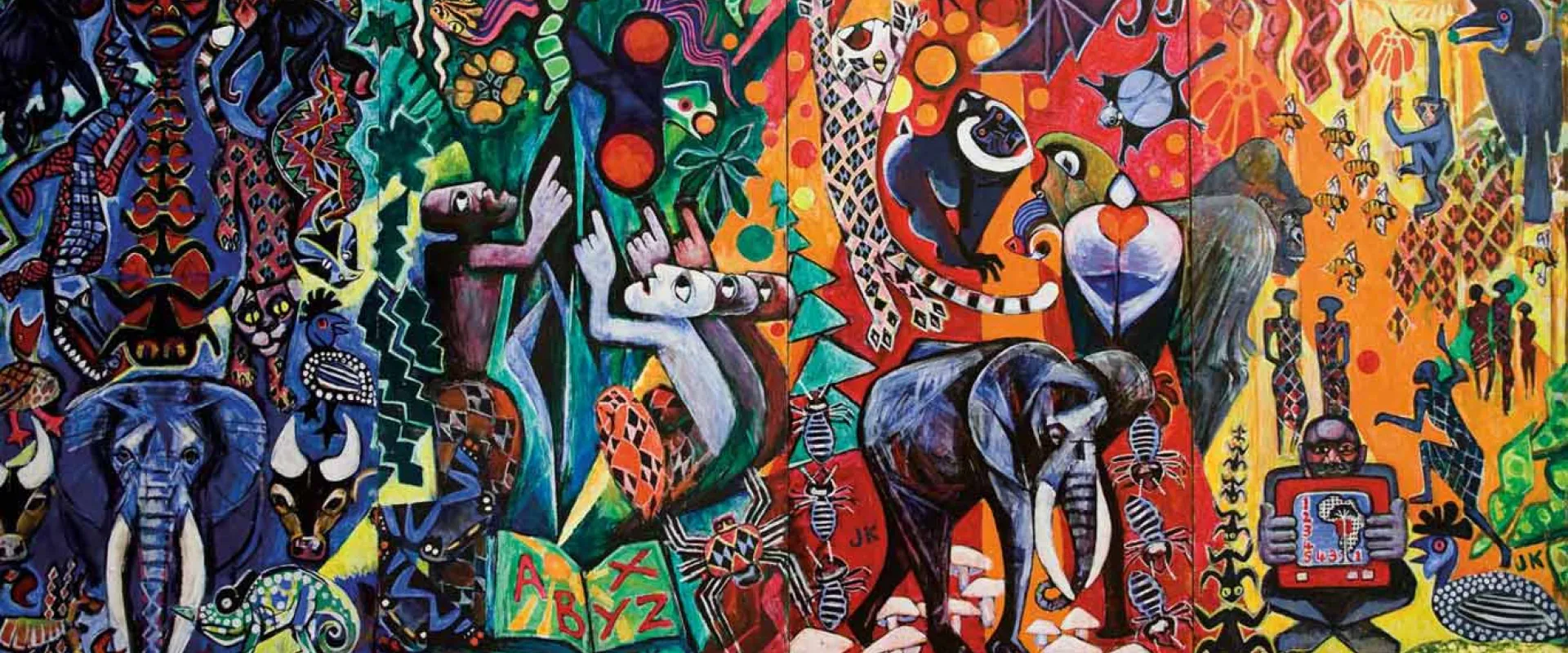 A large, vibrant, abstract mural depicting various animals (elephants, primates, leopards) and human figures in a colorful, symbolic landscape.