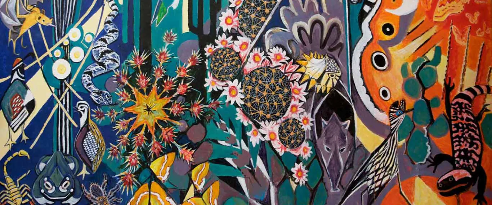 A brightly painted mural that displays a variety of desert plants, including cactuses, and animals including bats amongst swirls and patterns in different shades of reds, blues, and greens.