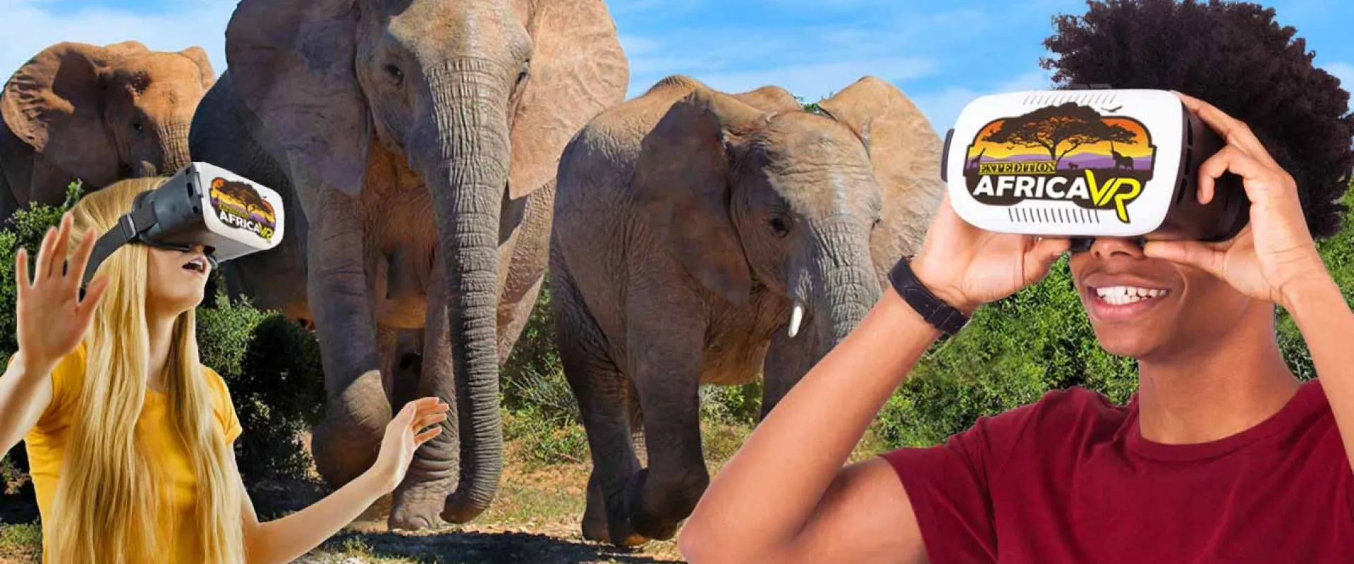 A man in a red shirt and a woman with long blonde hair stand wearing virtual reality goggles, their hands outstretched as if touching what they're seeing. Superimposed behind them is an image of three African Elephants running towards them across a savanna. The goggle screens read "Expedition Africa VR."