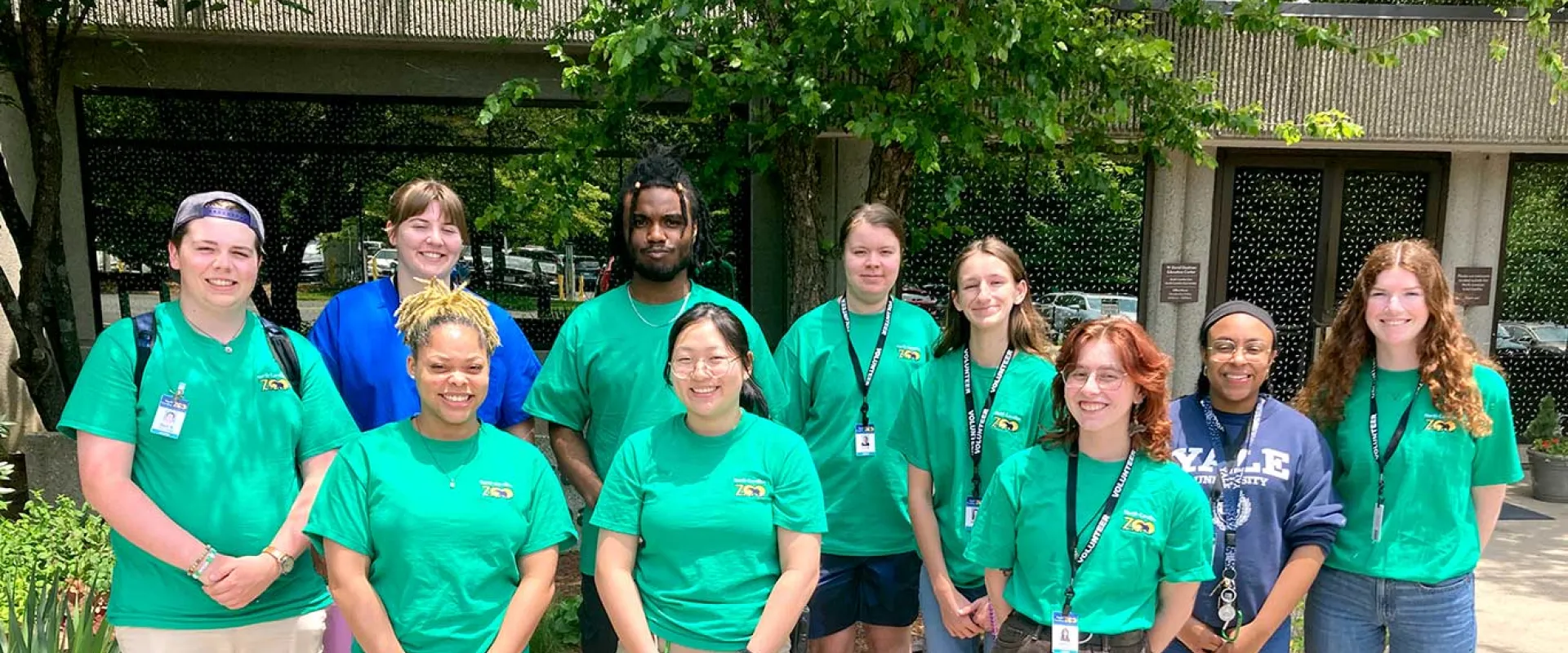 Group of ten Interns in standing in front of the Stedman Education center