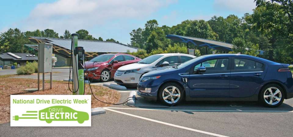 Drive electric event promo with electric vehicle charging station