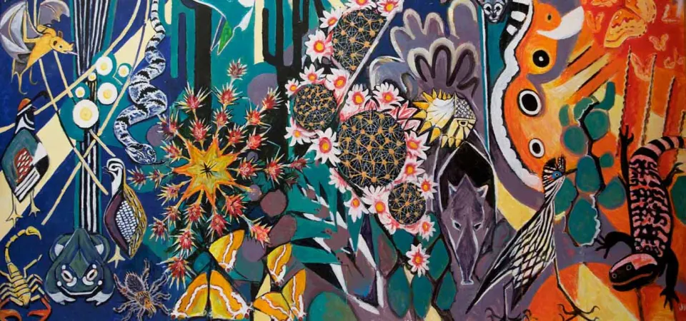A brightly painted mural that displays a variety of desert plants, including cactuses, and animals including bats amongst swirls and patterns in different shades of reds, blues, and greens.