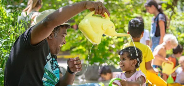 A father plays with his young daughter in the Kidzone Play Stream.