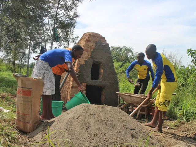 Members of conservation club building an incinerator